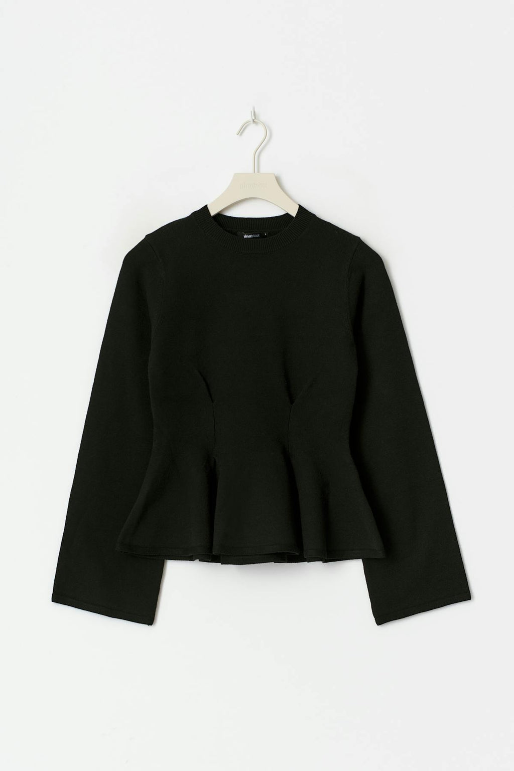 Knitted peplum top