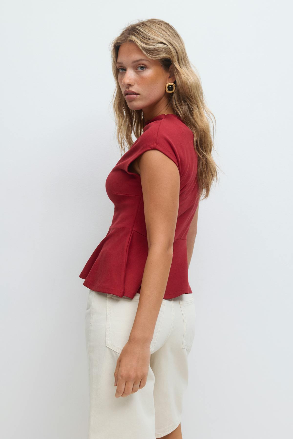 Funnel neck peplum top