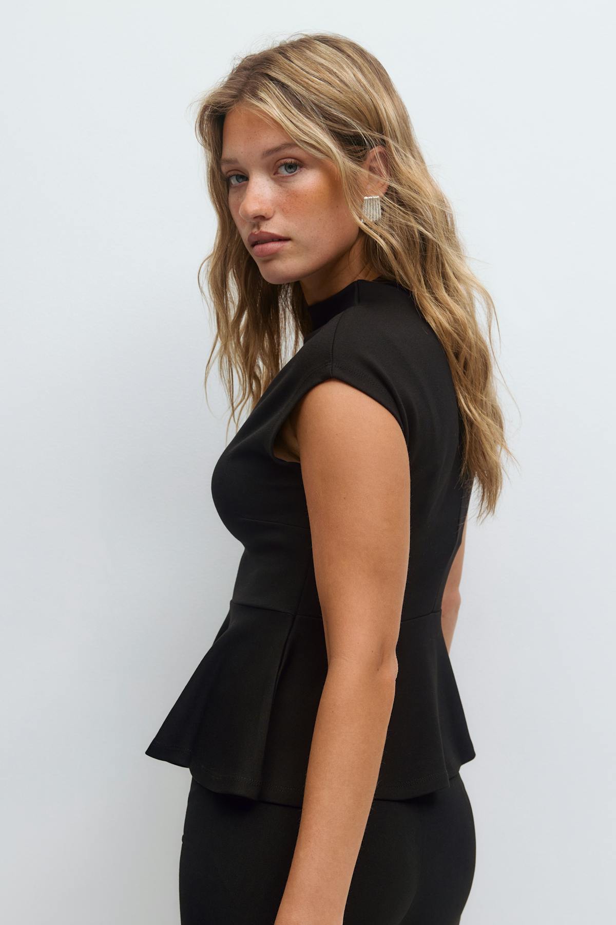 Funnel neck peplum top