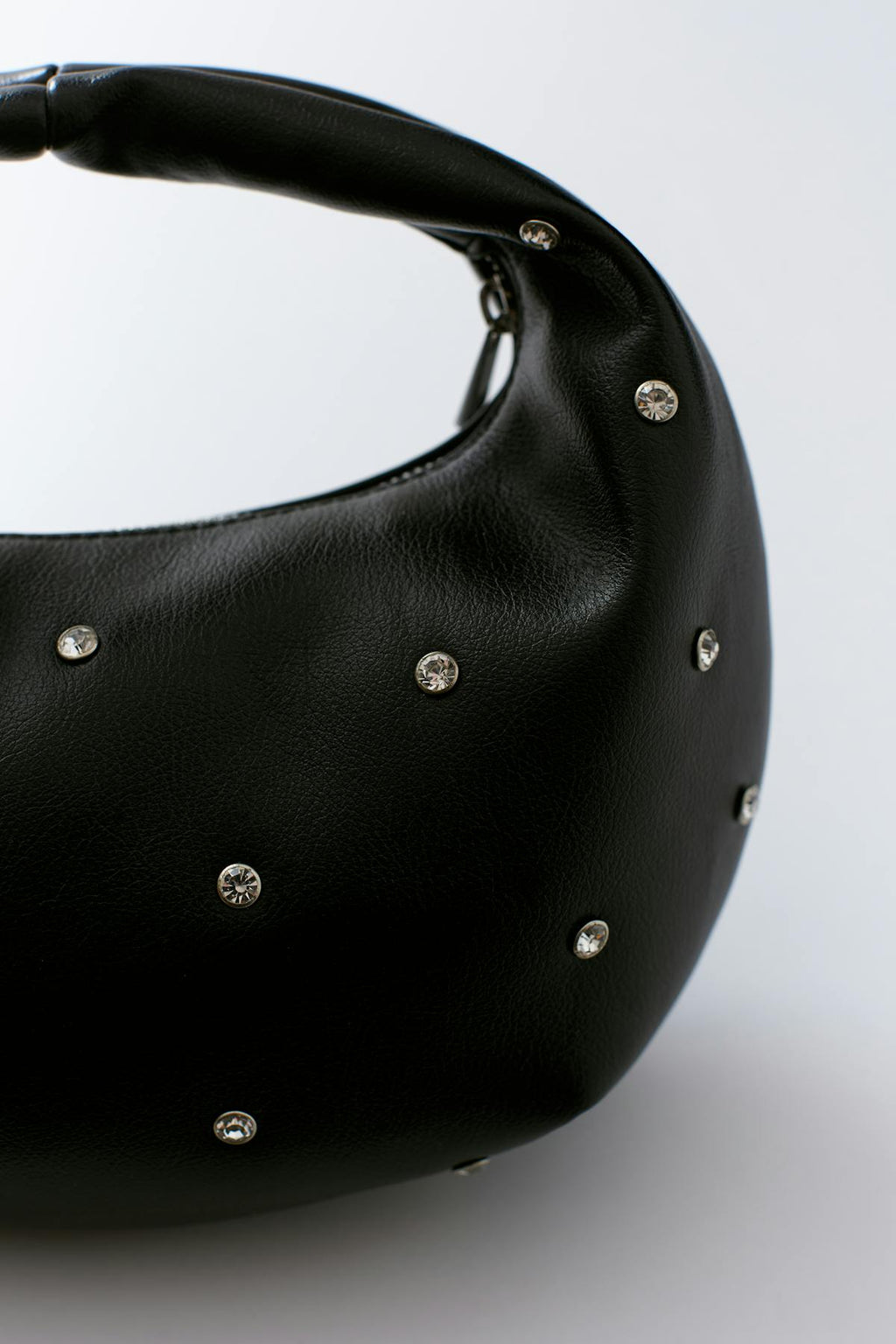 Soft round studded handbag