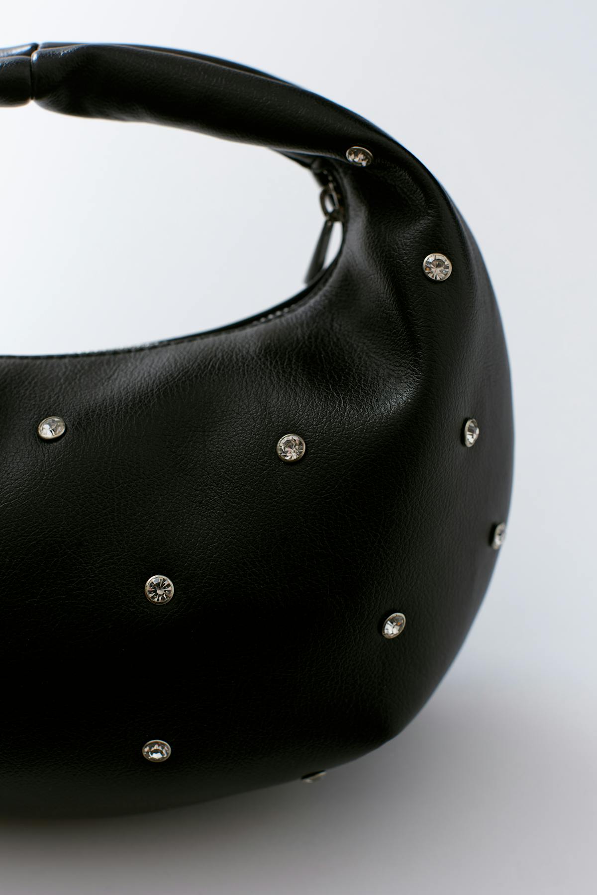 Soft round studded handbag