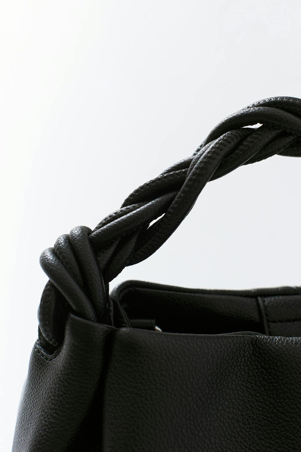 Small braided top handle bag