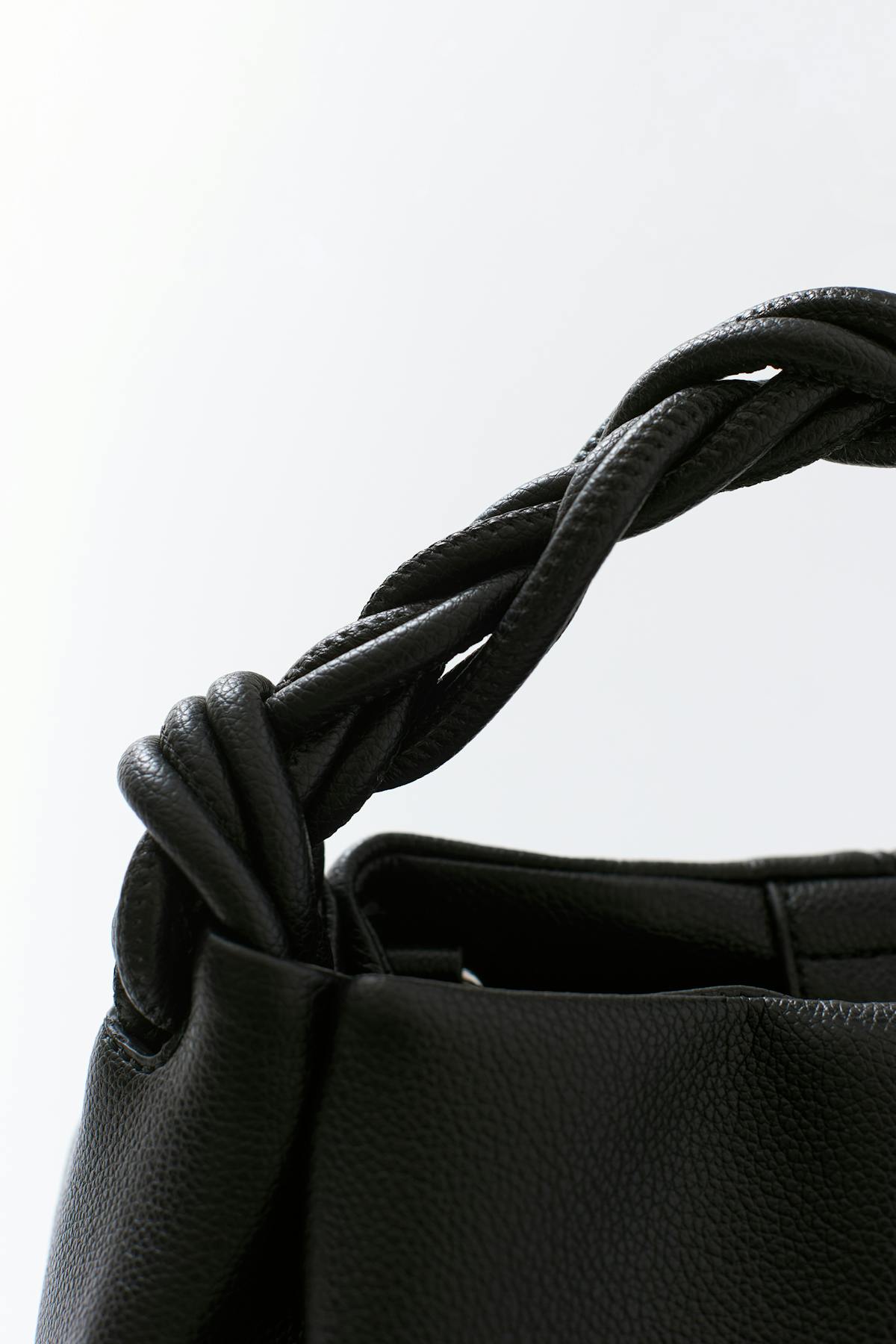 Small braided top handle bag