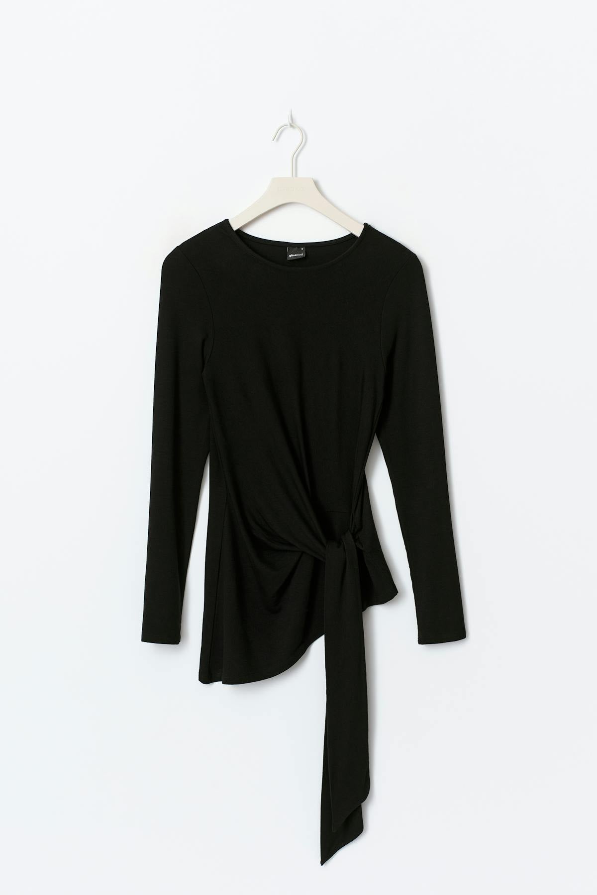 Asymmetric tie top