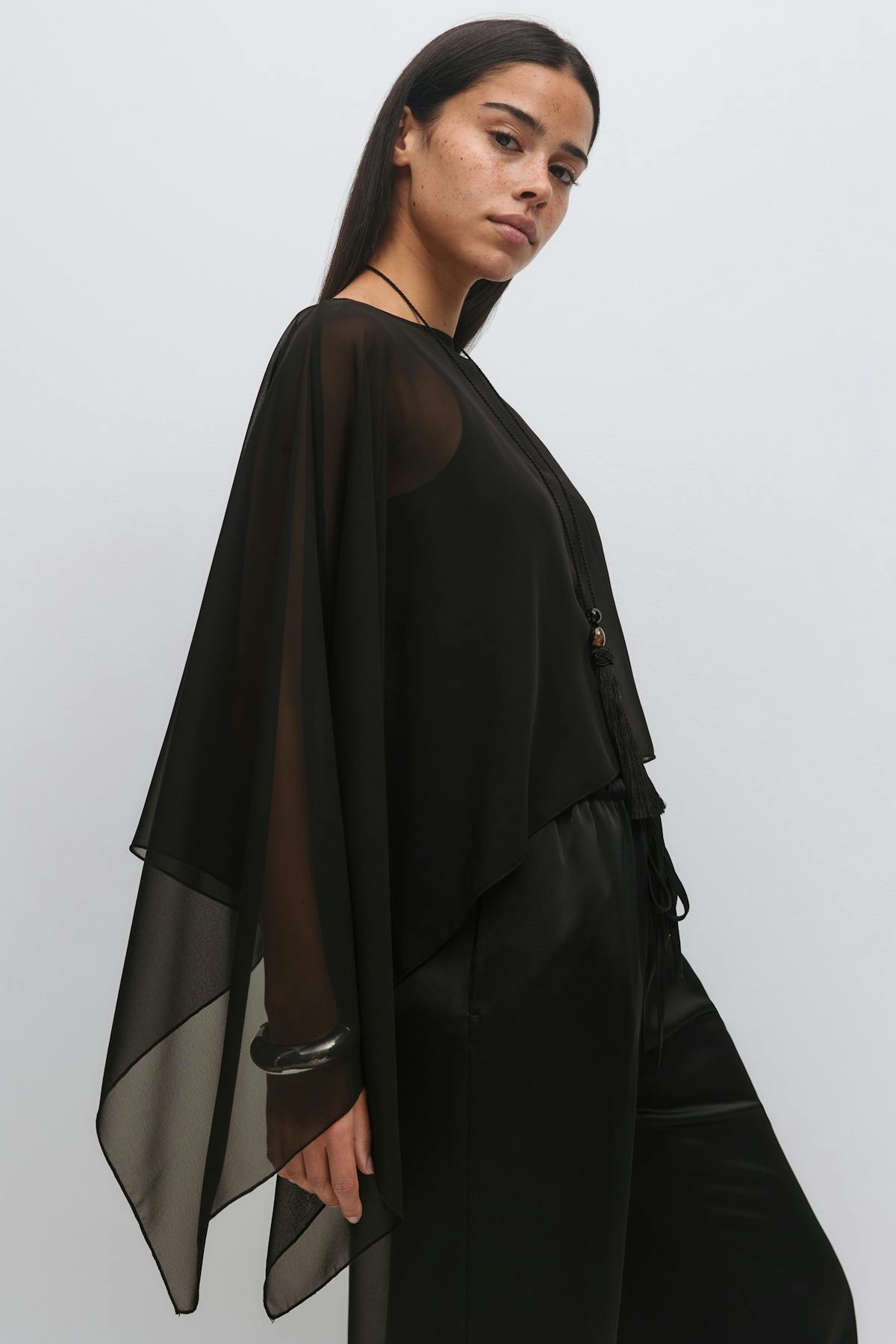 Sheer asymmetric poncho