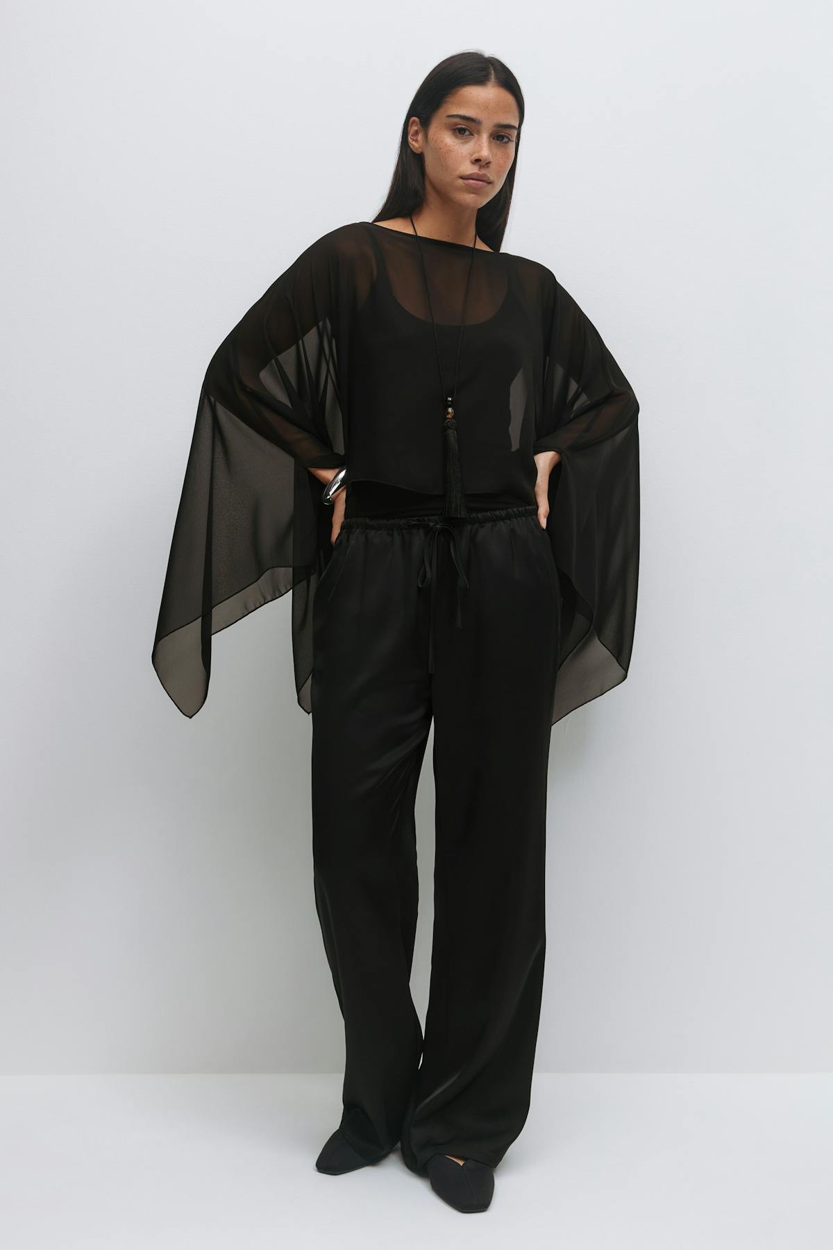 Sheer asymmetric poncho